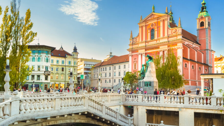 Romantic Ljubljana's city center: river Ljubljanica, Triple Bridge, Tromostovje, Preseren square and Franciscan Church of the Annunciation. Ljubljana, Slovenia, Europe.